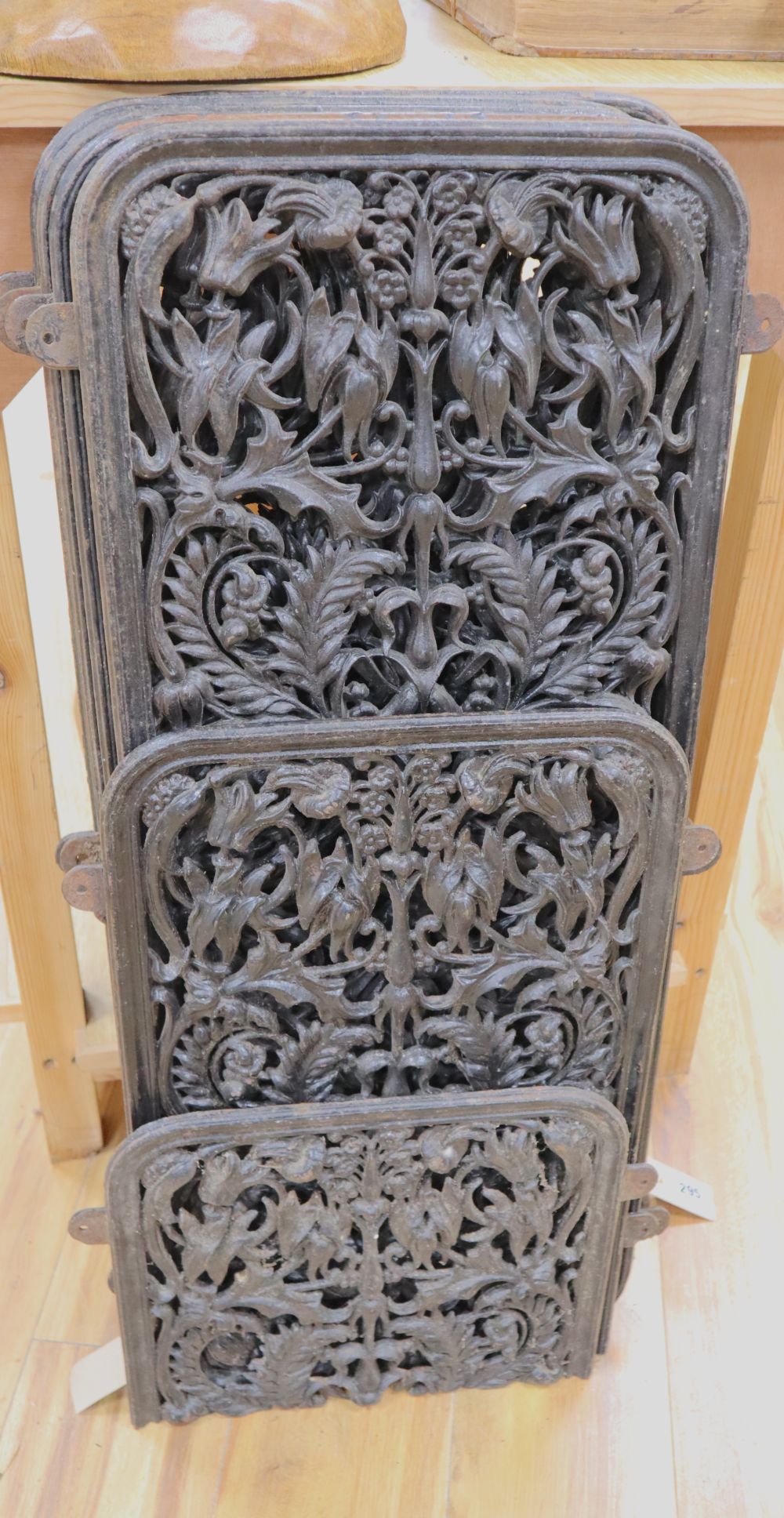 A set of six, possibly French, decorative cast iron panels, wrought and pierced with flowers and scrolling acanthus (one a.f.)